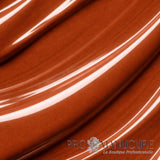 Texture vernis 1944 Paris Elora NGV277. Teinte brun caramel onctueuse au fini crème brillant.